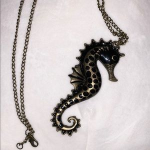 black & gold seahorse necklace